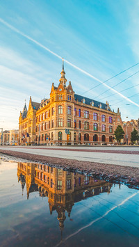 Historic building in Amsterdam centre under sunset light