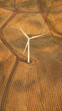 Photographer taking highaltitude photos of farmland