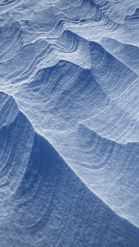 Blue wave snowy surface abstract ocean