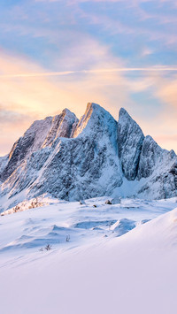 A top snowy mountain with colorful sky in morning