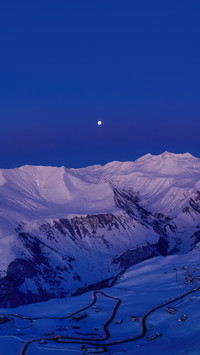Snowy mountain ridge on winter sunrise