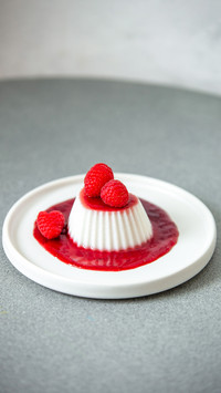 Vegan coconut raspberry panna cotta with berry decoration