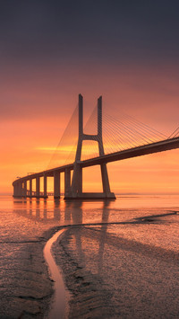 Cloudy sunrise at the Vasco da Gama Bridge in Lisbon