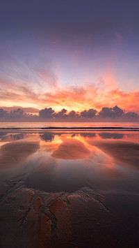 Beautiful sunrise reflections on the beach