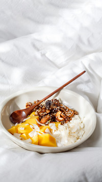 Homemade granola, yogurt and mango in a bowl