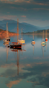 The calm lake surface and the boats