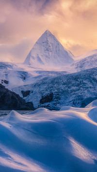 The Mysterious Snow Mountain Stands in Front
