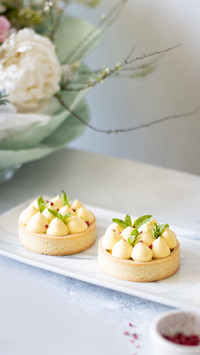 Homemade individual tarts with mango and raspberry