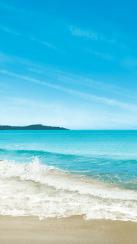 The sea and sky blend into one with waves dancing