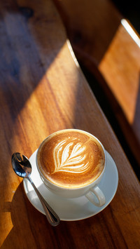A cup of coffee with latte art in the morning