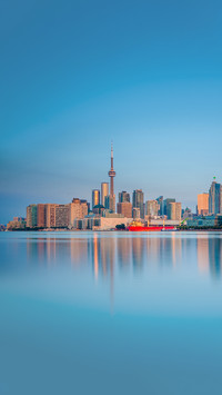 Skyline of Toronto over Ontario Lake at sunrise