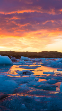 Ice light reflects on the lake surface.