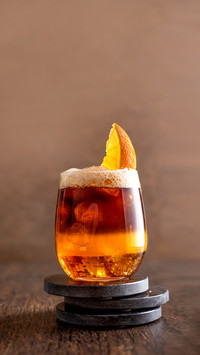 Bumble coffee layered cocktail with syrup and orange juice