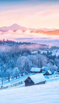 A Village with Snowy Mountain Ridge on Horizon