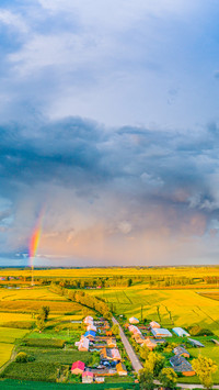Rainbow in Rain Cloud Rural Fields in Northeast China