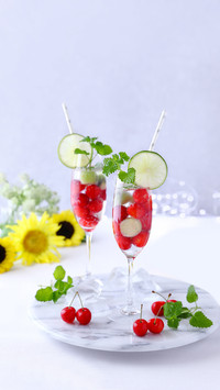Glasses of Soda with Fresh Cherry and Kiwi Fruits