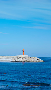 Red and white lighthouses in the port of sokcho