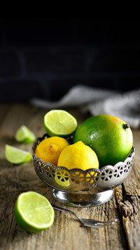 Citrus lime, lemon and mango in a metal bowl