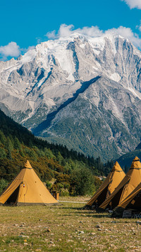 The camping scenery of snowcapped mountains and forests