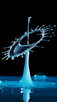 Closeup of water splashing against black background