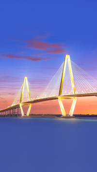 USA at Arthur Ravenel Jr. Bridge at dusk