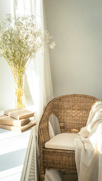 Cozy Reading Nook by the Window with Rattan Wicker Chair