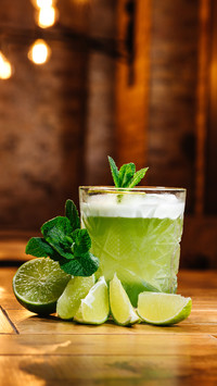 Close-up view of green van gogh cocktail in glass