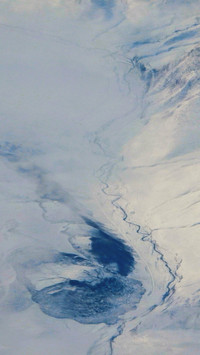 Snowy peaks and cold pools