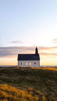 Strandkirkja (Strandar kirkja) in south Iceland at sunset