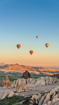 A hot air balloon floated over the cappadocia canyon