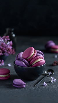 Pink and Purple Macarons on a Dark Background