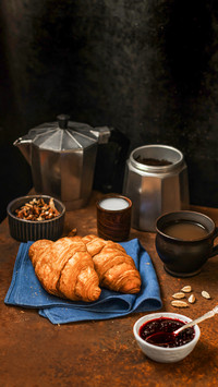 French breakfast. Freshly baked croissants, a cup of coffee