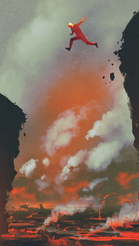 man jumping on the cliff against lava landscape 