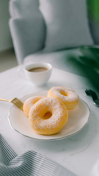 Classic donut and coffee on white table