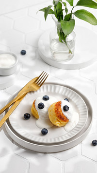Summer sunny breakfast with dessert. Creative and minimalism