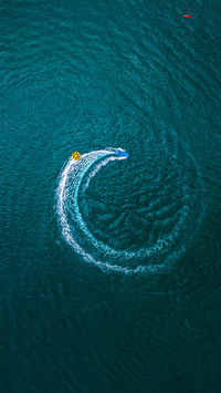 Boat makes a circle in the coastal sea of Sao Paulo