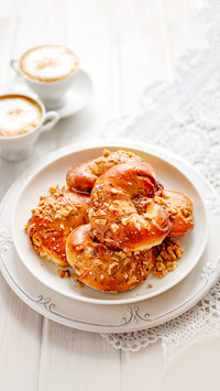 Croissants with cinnamon and walnuts on a plate