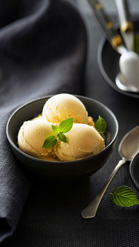 Homemade Organic Vanilla Ice Cream scoops on black table
