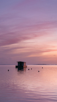 Sunset on Maldives island, water villas resort