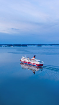 A Vessel Sailing On A Calm Sea In Winter Morning