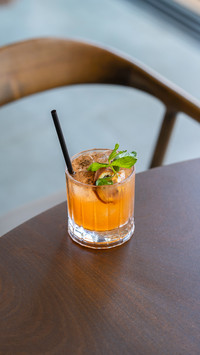 Signature cocktail with crispy coconut roll