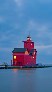 Holland Harbor Lighthouse stands at the entrance