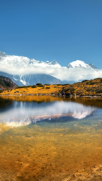 Beautiful view with high rocks with snow covered peaks