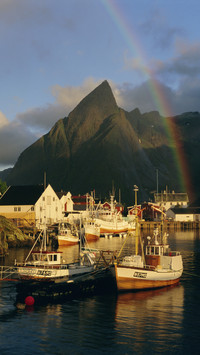 Rainbow over the colourful fishing village of hamnoy