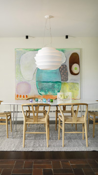 Dining set with pale wooden classic chairs on rug below