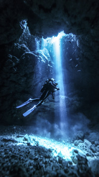 Diver under Sea in Cave