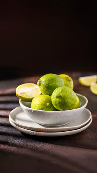 Fresh green limes with a strong summer light