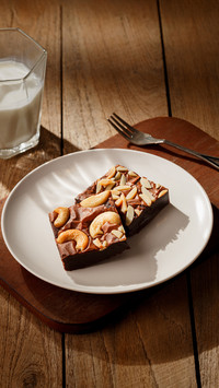Almond and cashew nuts chocolate brownie on table