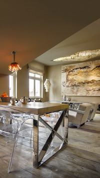 Transparent plastic chairs around table with chrome frame