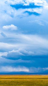Cloudscape on grassland before heavy storm